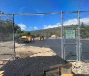 men repaving tennis court